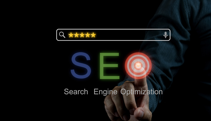 man touching hologram of word SEO