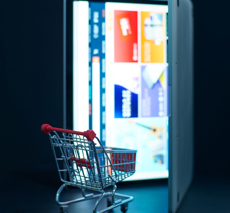 shopping cart against laptop